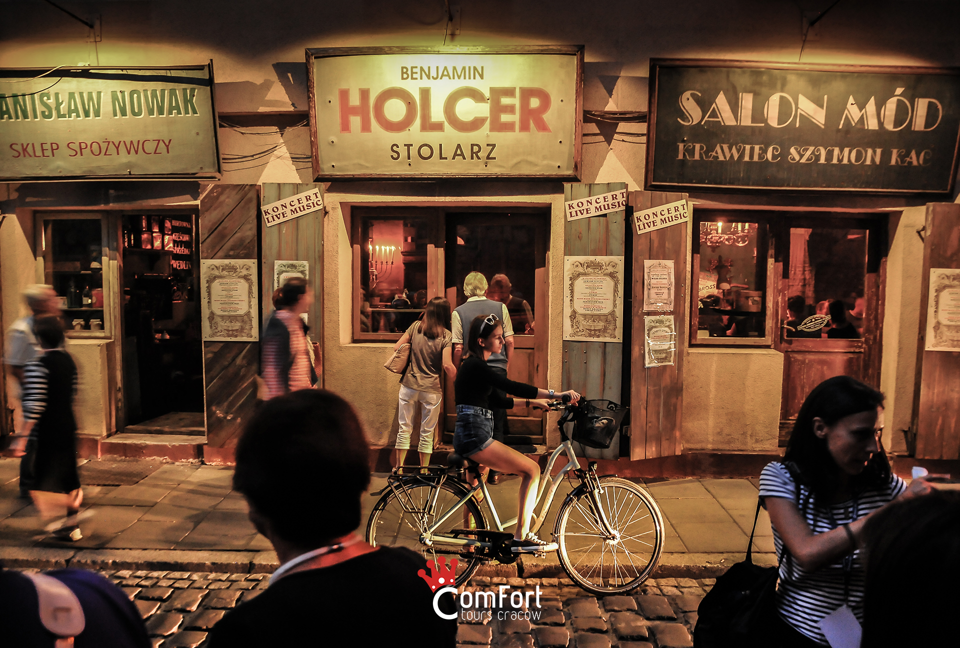 Atmospheric evening in Kraków's Kazimierz Jewish quarter with vintage shop signs